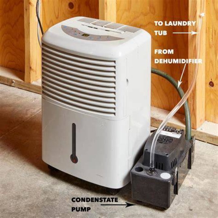 Why is my dehumidifier not draining through the drain hose properly?